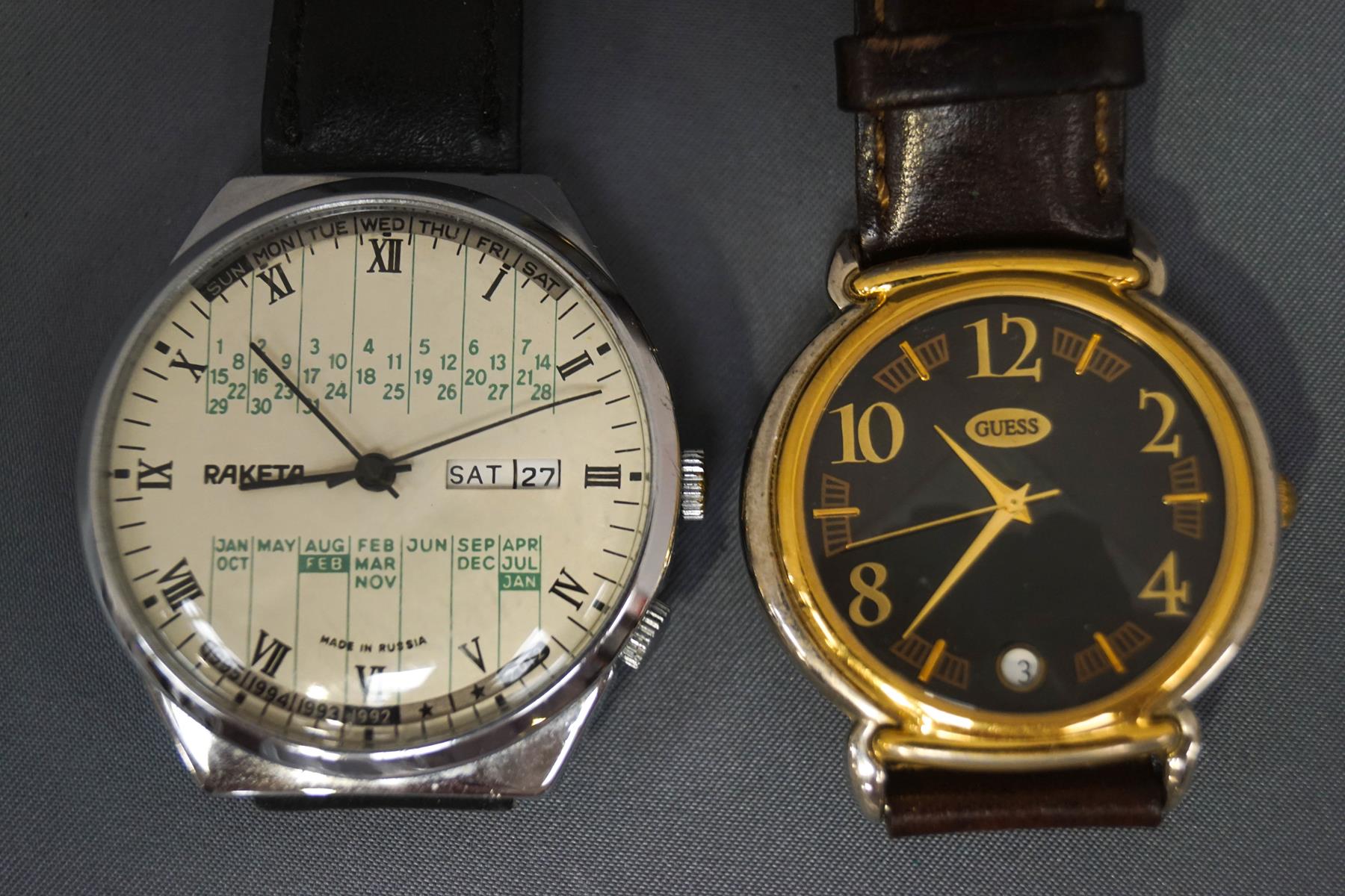 A Russian calendar wrist watch; and a modern 'Guess' fashion wristwatch;