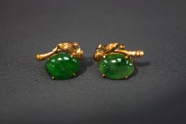 A pair of jade ear studs
