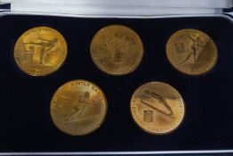 A set of five 1988 Calgary Olympic Games medals, in case.