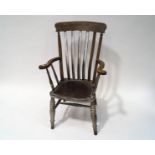 An early 20th century stick back elbow chair with solid seat and turned legs,