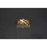 A 9 carat three coloured gold ring, of knot design, finger size O1/2, 3.