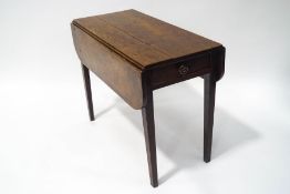 A 19th century oak Pembroke table with one frieze drawer on square tapering legs, 70cm high x 41.