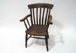 An oak elbow chair,