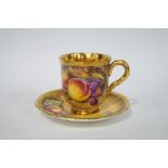 A Royal Worcester cabinet cup and saucer painted with fruit, signed S.