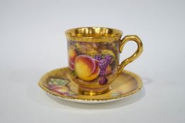 A Royal Worcester cabinet cup and saucer painted with fruit, signed S.