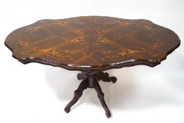 A 20th century mahogany and marquetry dining table,