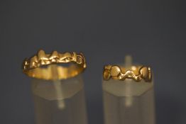 A 9 carat gold mushrooms ring; with a 9 carat gold abstract ring; 5.