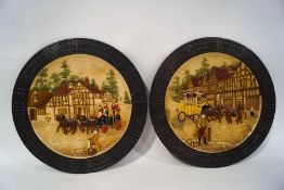 A pair of Bretby pottery wall plaques, each moulded in relief with as coach and horse,