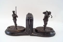 A pair of modern bronze patinated bookends, modelled as Victorian golfers, signed REECE '09,