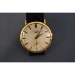 Longines, a gentleman's gilt metal mechanical wrist watch, with white rayed dial, gilt batons,