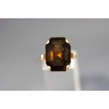 A smokey quartz single stone ring, stamped '14K', finger size Q, 8.