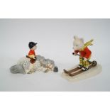 A Royal Doulton figure : 'Rupert Bear Takes a Skiing Lesson', printed marks, 11cm high,