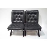 A pair of Danish style leather and faux rosewood chairs with button backs and seats,
