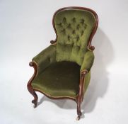 A Victorian mahogany button back armchair with carved frame,