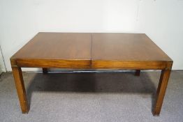 A 20th century mahogany Campaign style dining table with one loose leaf and applied brass mounts,