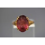 A 9 carat gold amethyst coloured paste single stone ring, finger size L, 2.