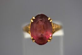 A 9 carat gold amethyst coloured paste single stone ring, finger size L, 2.