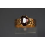 A 9 carat gold garnet ring, finger size M, 3.