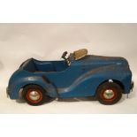 A 1950's Tri-ang child's pedal car, with working 'radio',