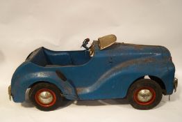 A 1950's Tri-ang child's pedal car, with working 'radio',
