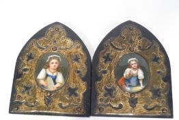 A pair of 19th century Continental porcelain plaques, each painted with a figure of a young girl,