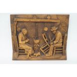 A carved oak plaque by C.A.