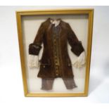 An 18th century gentleman's velvet and gold braided frock coat,