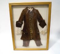 An 18th century gentleman's velvet and gold braided frock coat,