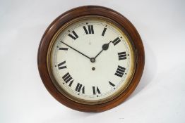 A mahogany cased dial clock, together with the key and pendulum,
