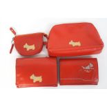 Two Radley purses and two Radley wallets, all with a Scottie dog on a red ground,