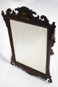 A George II style wall mirror, the mahogany fret frame with applied gilt coronet on a cushion,