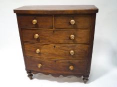 A Victorian mahogany chest of two short and three long drawers, on turned legs,