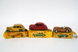 Three Dinky Toys, No.154 Hillman Minx Saloon, No.151 Triumph 1800 Saloon, and No.