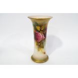 A Royal Worcester vase of flared cylindrical form, painted with roses and gilt decoration,