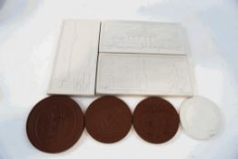 A set of four Meissen bisque porcelain rectangular moulded plaques, 14cm wide,