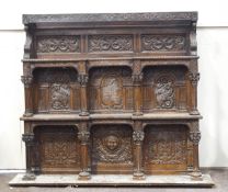 A 19th century oak over-mantel, incorporating various earlier carved panels,