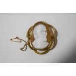 A cameo in gilt metal mount, carved with the profile of a bearded gentleman,