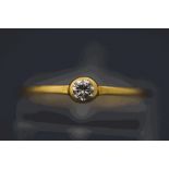 An 18 carat gold single stone diamond ring, the collet set brilliant of approximately 0.