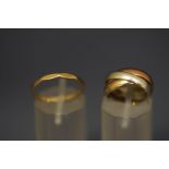 A 9 carat gold three colour 'Russian' wedding ring; and a 9 carat gold ring; 4.