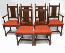 A set of six Victorian style oak dining chairs, with ecclesiastical carved detail to the backs,