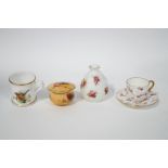 Four miniature porcelain ornaments, comprising a Royal Worcester box and cover, Royal Worcester mug,