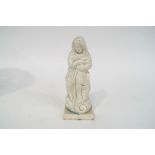 A late 18th/early 19th century Pearlware figure of a child wrapped in a shawl on square plinth,