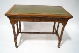 A late 19th century Gillows and Co mahogany writing desk with green leather inset top,