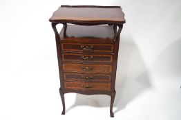 An Edwardian mahogany music cabinet with shaped top and applied gallery (two sides detached but