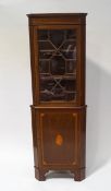 An Edwardian mahogany standing corner cabinet with satinwood cross banding and one astral glazed