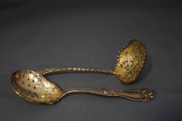 A late Victorian silver sifting spoon,