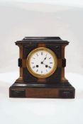A late 19th century walnut and ebonised mantel clock, with two train movement striking on a bell,