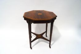 An Edwardian rosewood octagonal occasional table, inlaid with marquetry on square tapering legs,