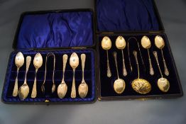 A set of six silver tea spoons, with sugar tongs and sifting spoons, by William Devenport,
