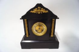 A Victorian slate eight day mantel clock, of architectural form, with pendulum and key,